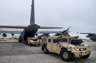 1200px-Loading_Humvees_1.jpeg