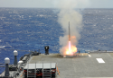 Japon HYUGA launches missile from VLS in flight deck.PNG