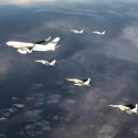 EAF' MiG-29M2s escorting Putin IL-96-300 .jpg