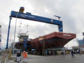 The_forward_island_of_the_queen_elizabeth_class_aircraft_carrier_being_attached_to_the_main_bo...jpg