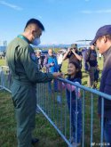 PLAAF crew and a Chinese girl in Austria.jpg